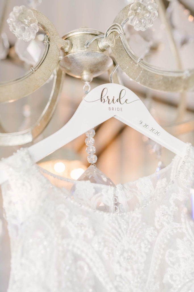 Bridal gown hanger inscribed with the words bride and wedding date