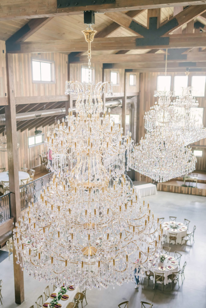 Large crystal chandeliers hanging over the reception hall