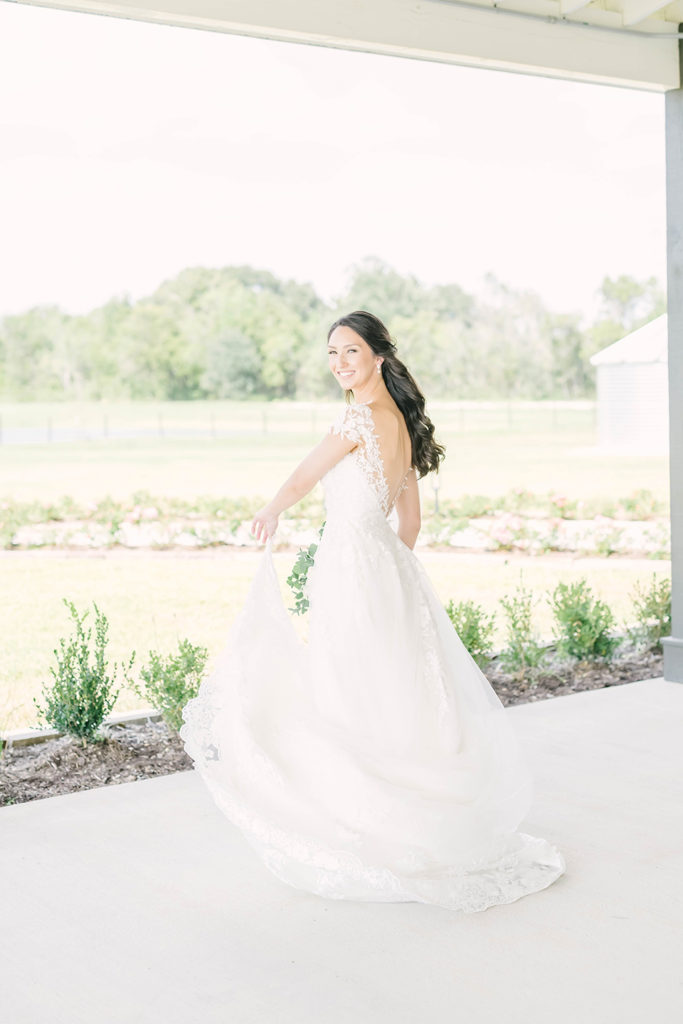 Gorgeous location for bridals at Still Waters Ranch Event Venue in Alvin, TX by Christina Elliot Photography. locations for bridals in texas outdoor bridal locations in houston white sheer and lace wedding dress bridal hair inspo bridal poses outdoor bridal photoshoot brazoria county locations for bridals in texas outdoor photoshoot in houston #houstontexasphotographer #alvintxweddingphotographer #texasweddingphotography #outdoorbridalformals #bridalphotography