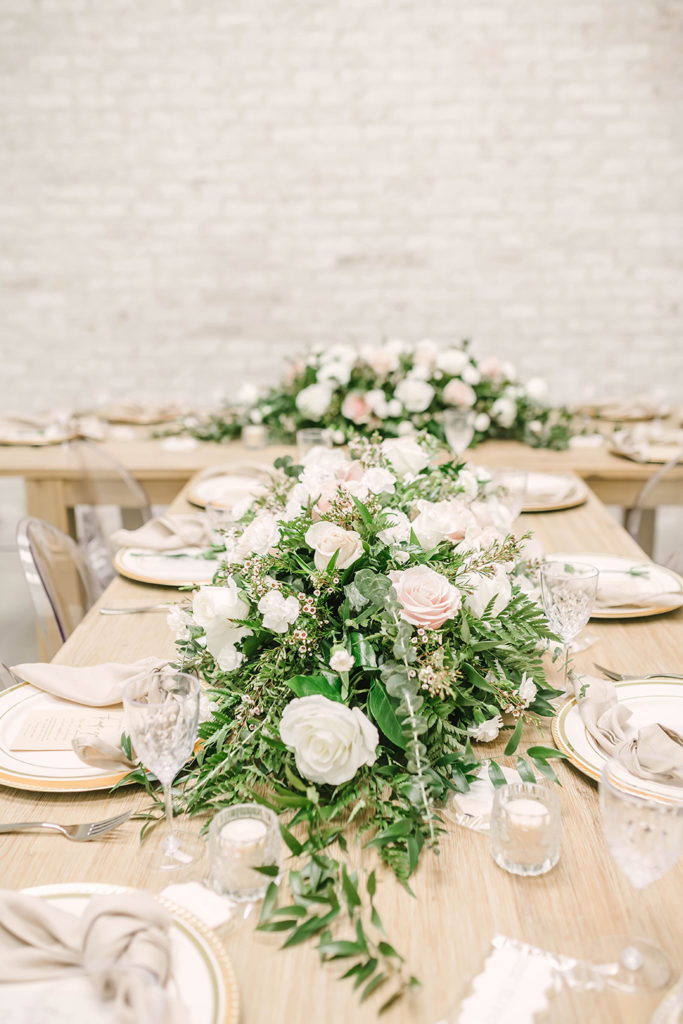 Gorgeous wedding table decor for wedding dinner with green garland and white and pink flowers by Christina Elliot Photography in Houston, TX. wedding dinner ideas wedding dinner decor inspo how to set the table for wedding dinner garland for wedding dinner decorating wedding table white and pink wedding flowers houston texas wedding photoraphy #houstontexasphotographer #houstonweddingphotographer #texasweddingphotography #greenhousewedding #outdoorweddinginspo