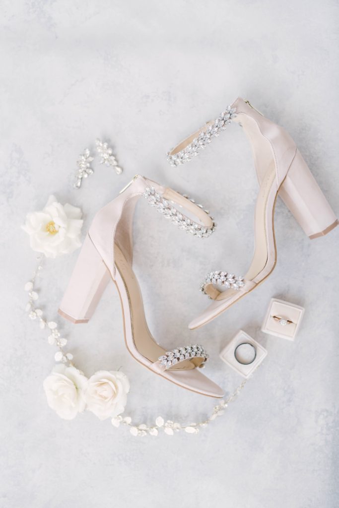 Gorgeous details from the bride’s wedding day attire, including her shoes, ring, and necklace. Pearl wedding jewelry classy bridal jewelry detail shot Christina Elliott Photography Houston wedding photographer couples photographer summer wedding shoe inspiration
