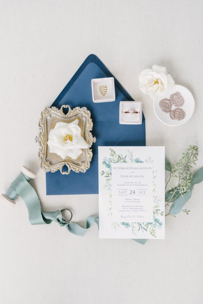 Invitation suite styled with florals and pale pink ring box photographed by Christina Elliott Photography