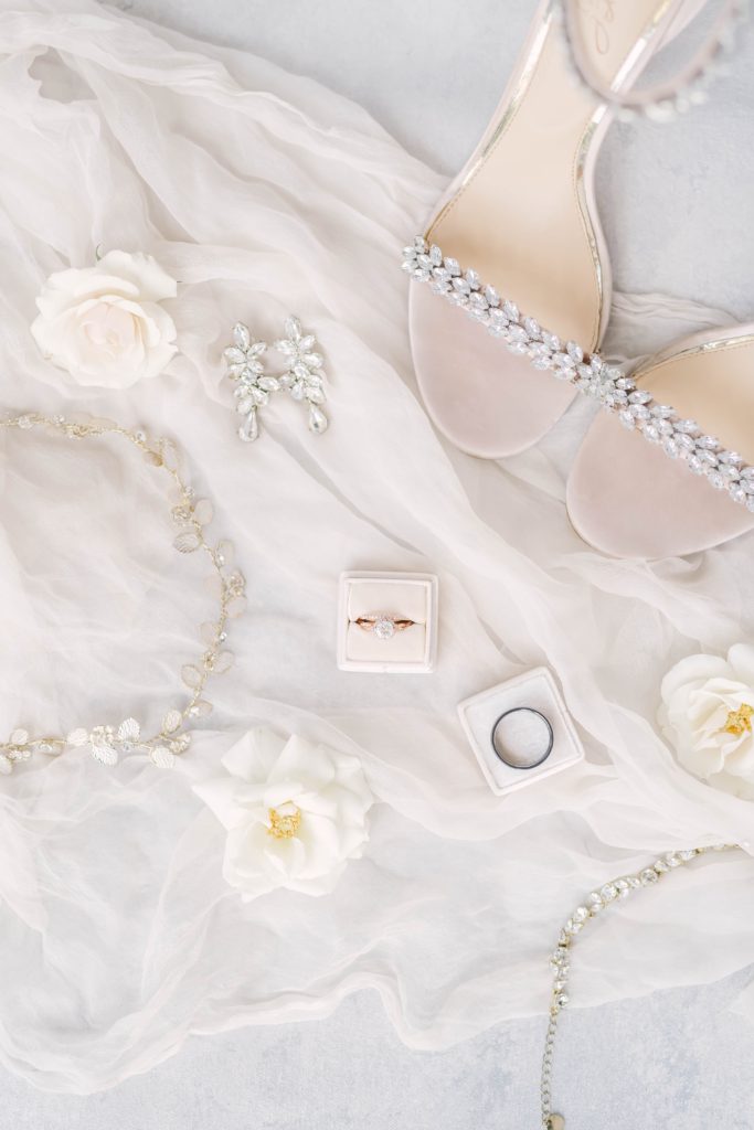 Jeweled bridal shoes along the wedding rings and diamond cascading earrings