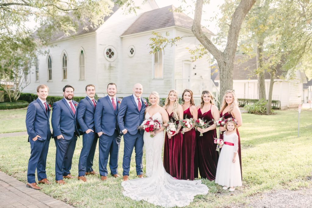 A gorgeous group shot of the bride, groom, and their wedding party on wedding day in Houston, Texas. Wedding party group shots large wedding party pose inspo bridal party dress colors bridesmaids bouquet ideas wedding day photos Christina Elliot photography