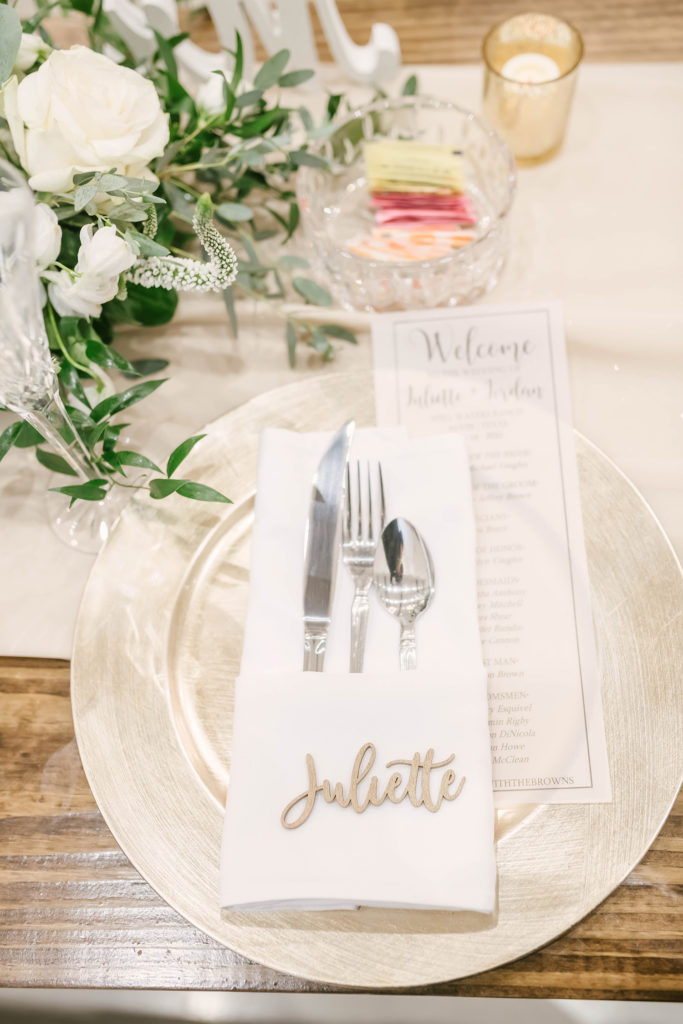 The beautiful detailed place settings at this barn style wedding in Houston, Texas captured by Christina Elliot Photography. Place settings table top name place cards napkins plates wedding inspiration inspo flower centerpiece gold candle schedule of the day Houston photographer #houstonweddingphotographer #texasphotographer #weddingdaydetails #barnstylewedding #stillwatersranch #alvintexasphotographer #weddingday #brideandgroom #texanwedding #htxwedding #countrywedding