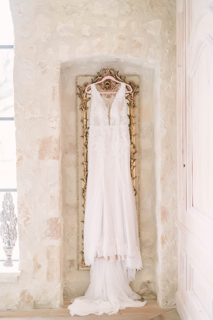 A beautifully detailed shot of the wedding dress in the Clubs at Houston Oaks bridal suite captured by Christina Elliott Photography.