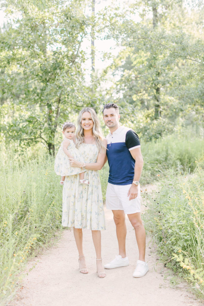 Beautiful family pose for spring family portraits with Christina Elliott Photography at the Houston Arboretum.