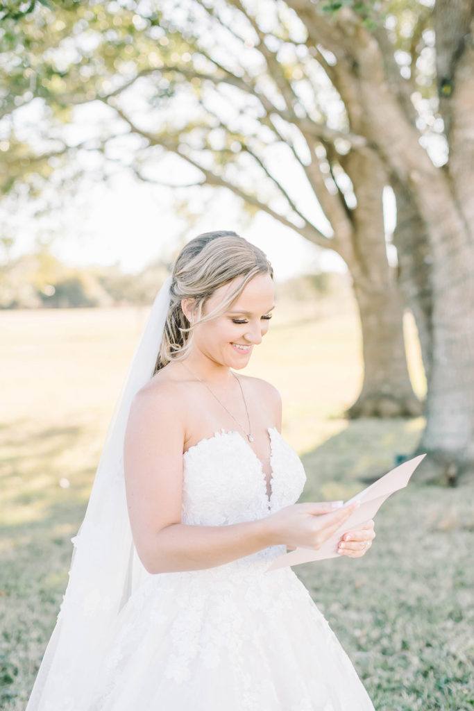Bride reads a note from her fiancé before the wedding ceremony
