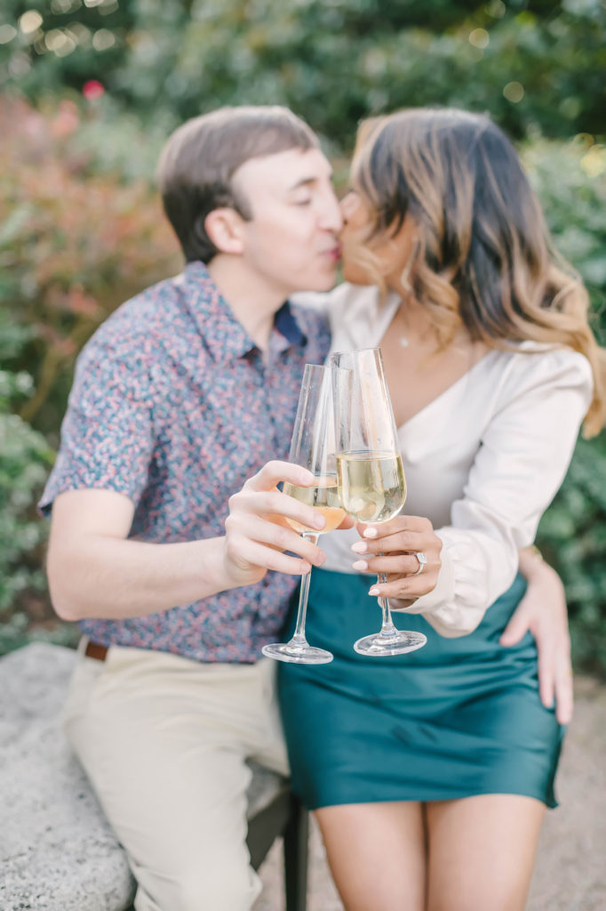 A kiss and a drink to celebrate their engagement session with Christina Elliot Photography in Houston, Texas. Montgomery texas wedding photography kisses love engaged soon to be married champagne flutes glass engagement ring together wedding nail inspo neutral color details candid moment #houstonweddingphotographer #engagementpics #houstonphotographer #engagementphotos #shesaidyes #texasphotographer #photoinspiration #weddingphotography #houstonphotographer #soontobemarried