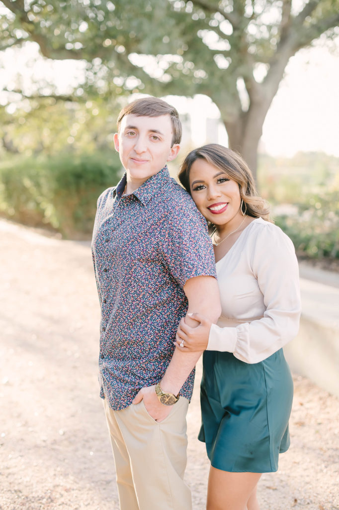 A beautiful picture of a couple at their engagement session in Downtown Houston, Texas with Christina Elliot Photography. Happy couple love engaged downtown Houston texas wedding photographer engagement pictures semi formal outfit wear engagement inspo #christinaelliotphotography #houstonweddingphotographer #engagementpics #houstonphotographer #engagementphotos #shesaidyes #texasphotographer #photoinspiration #weddingphotography #houstonphotographer