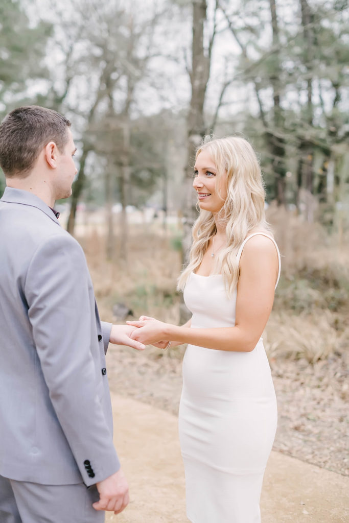 Couple exchanges rings during their intimate wedding ceremony at Memorial Park Eastern Glades area of the park. Houston elopement photographer. Houston wedding photographer. Christina Elliott Photography