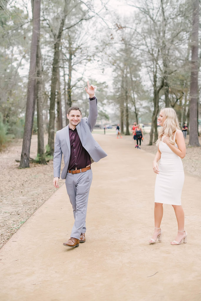Groom celebrates after becoming husband and wife at their elopement ceremony at Memorial Park.