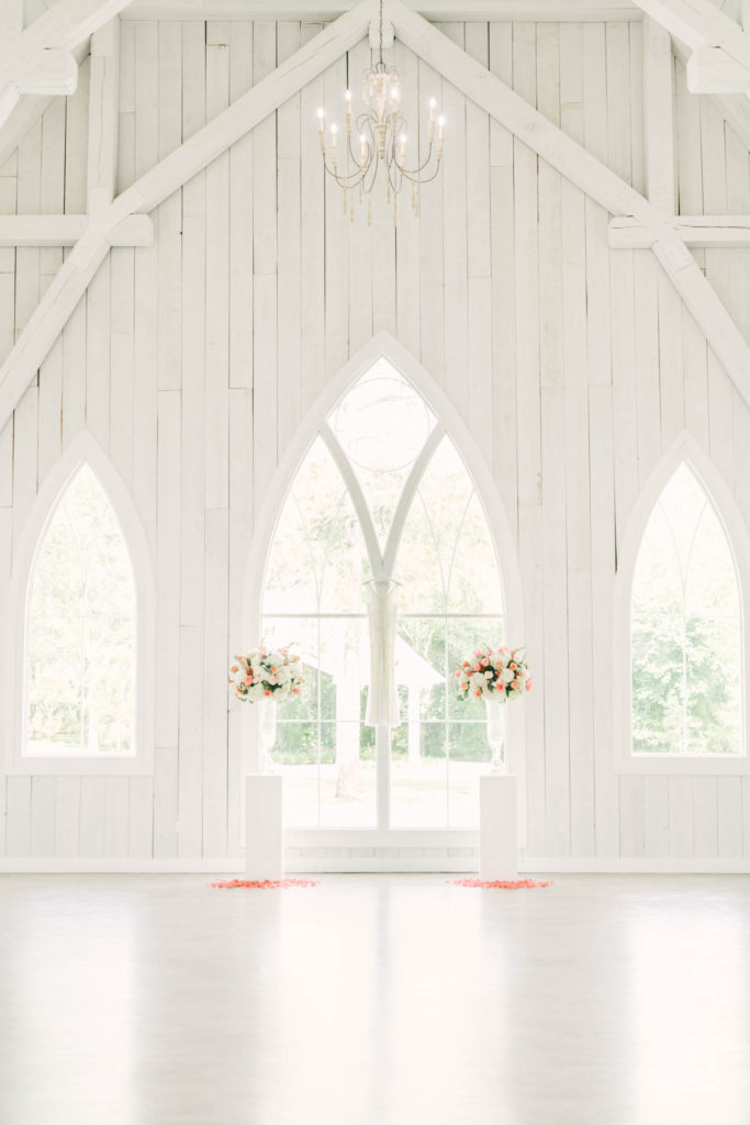 Gorgeous white barn wall with windows at the Trinity Farmhouse in Wallsville, Texas captured by wedding photographer Christina Elliott Photography. wedding ceremony locations texas beautiful barn weddings wallsville barn #christinaelliotphoto #christinaelliotphotography #christinaelliotelopements #elopementphotographer #wallisvillewedding #houstontexaswedding #houstonweddingphotographer #trinityfarmhouse #texaselopements #elopement #springwedding