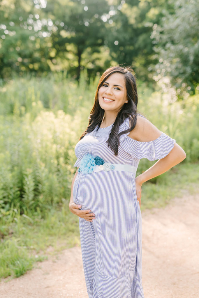 Pregnant woman in a maternity shoot wearing a cute purple dress Christina Elliot Photography. colors to wear for boy photoshoot dresses to wear for maternity shoot most flattering outfit for maternity how to dress your bump purple dress summer color for photoshoot how to do your hair for maternity session texas maternity photographer bump outfits #maternityphotos #maternityphotoshoot #maternityphotographers #texasmaternityphotographers #outfitinspoformaternityphotoshoot