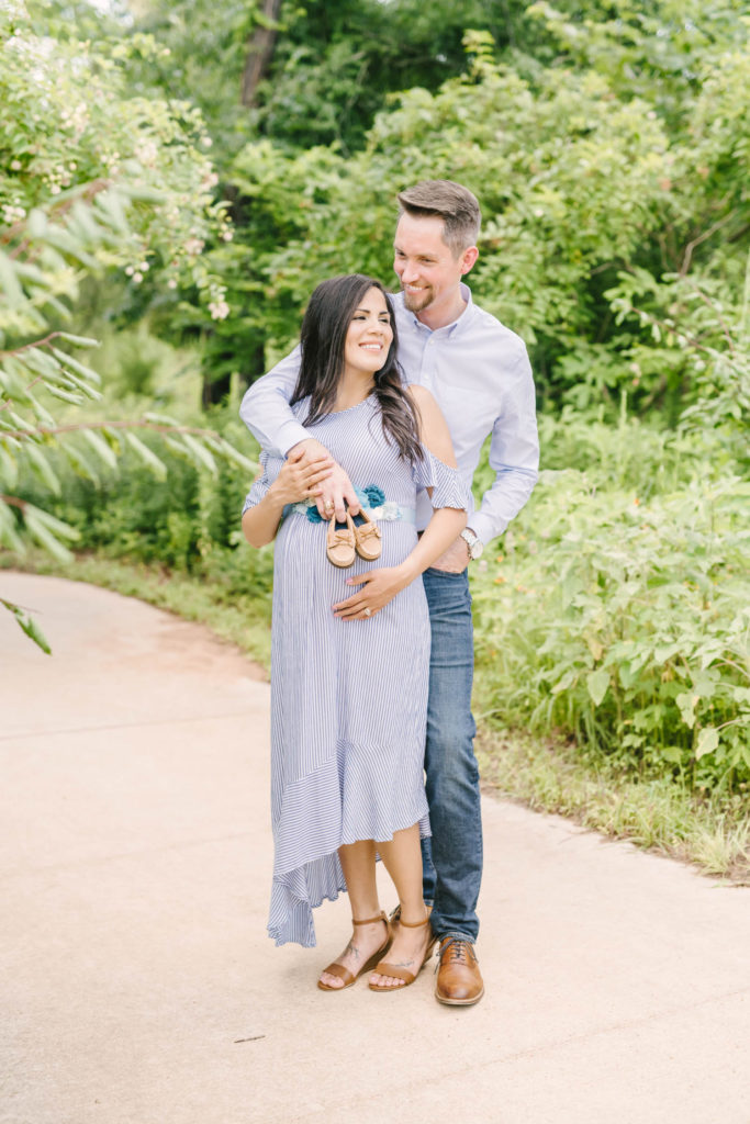 Gorgeous couple in a maternity photoshoot wearing purple Texas by Christina Elliot Photography in Texas. colors to wear for maternities couple poses for maternity photoshoot candid maternity shots when should i take maternity photos couple maternity photoshoot summer colors for photoshoot dressing your bump for photoshoot maternity photographer in texas #maternityphotos #maternityphotoshoot #maternityphotographers #texasmaternityphotographers #outfitinspoformaternityphotoshoot