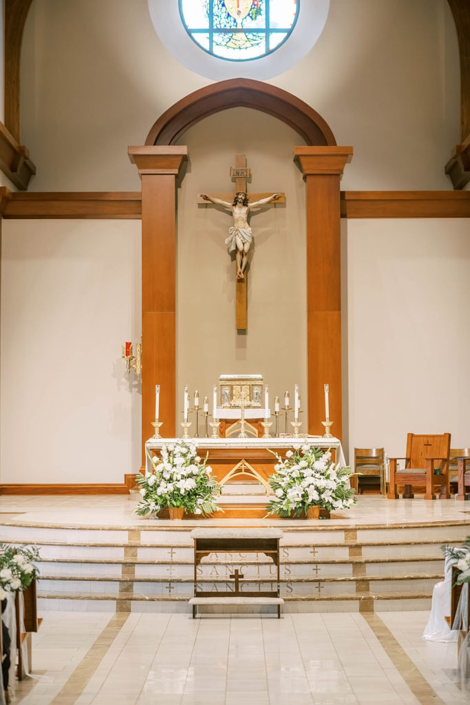 Beautiful wedding altar in church with lots of gorgeous white flowers for a farmhouse summer wedding by Christina Elliot Photography in Texas. wedding decor inspo how to decorate the altar for your wedding church wedding decor how to decorate your church wedding farmhouse wedding decor white flowers for wedding #texasweddingphotographer #farmhousewedding #farmhouseweddinginspo #texasphotographer #farmhouseweddingdecor #texasweddinglocations