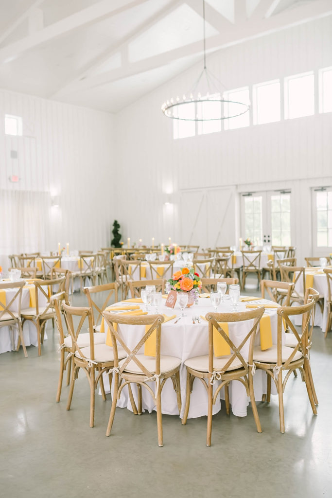 Perfect colors and table decor for a summer farmhouse wedding in Texas by Christina Elliot Photography. red and yellow wedding colors summer wedding colors table decor for wedding how to decorate for summer wedding the best wedding colors for the summer how to do a farmhouse wedding colors for wedding red and yellow and orange #texasweddingphotographer #farmhousewedding #farmhouseweddinginspo #texasphotographer #farmhouseweddingdecor #texasweddinglocations