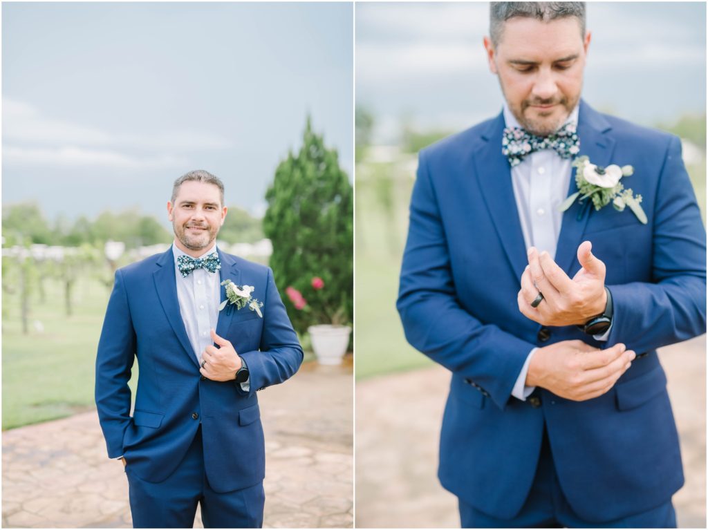 Groom in blue suit, white shirt and blue floral bowtie buttons his suit coat and smiles for a portrait outside at a winery in Texas by Christina Elliott Photography. blue wedding suit bowtie for wedding groom style groom attire ideas #christinaelliottphotography #christinaelliottweddings #Winerywedding #Houstonweddings #newlyweds #weddingdress #weddingphotography #Houstonweddingphotographers #dreamyweddings #bluesuit #weddingstyle #mrandmrs #weddinggoals #Houstonphotographers
