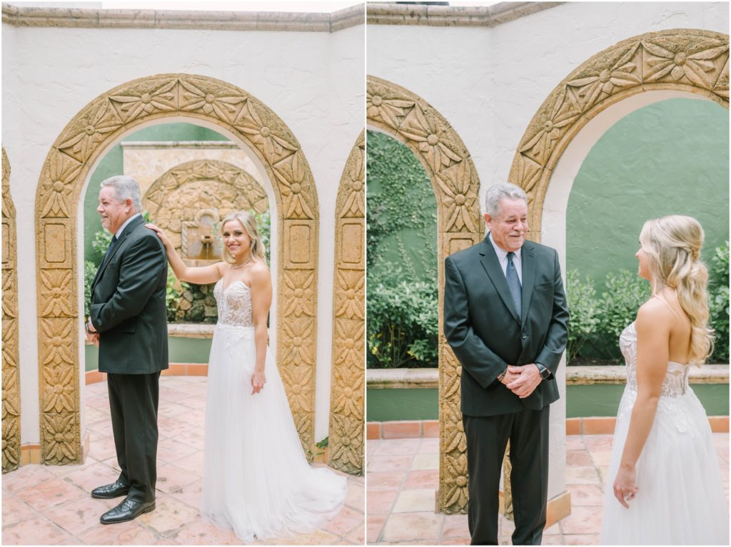 Father of the bride gets the first look at his daughter in her white wedding dress in the arch courtyard at The Bell Tower on 34th in Houston by Christina Elliott Photography. father's first look at dress father of the bride #christinaelliottphotography #christinaelliottweddings #thebelltoweron34th #belltowerwedding #houstonweddings #houstonweddingphotographers #mrandmrs #newlymarried #weddinginspiration #bridalgown #groomstyle #texasweddingphotographers #tietheknot #traditionalindianwedding