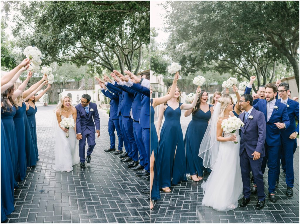 The wedding party makes an arch for the bride and groom to walk down in Houston Texas by Christina Elliott Photography. bridal party photography poses bridal party attire inspiration #christinaelliottphotography #christinaelliottweddings #thebelltoweron34th #belltowerwedding #houstonweddings #houstonweddingphotographers #mrandmrs #newlymarried #weddinginspiration #bridalgown #groomstyle #texasweddingphotographers #tietheknot #traditionalindianwedding