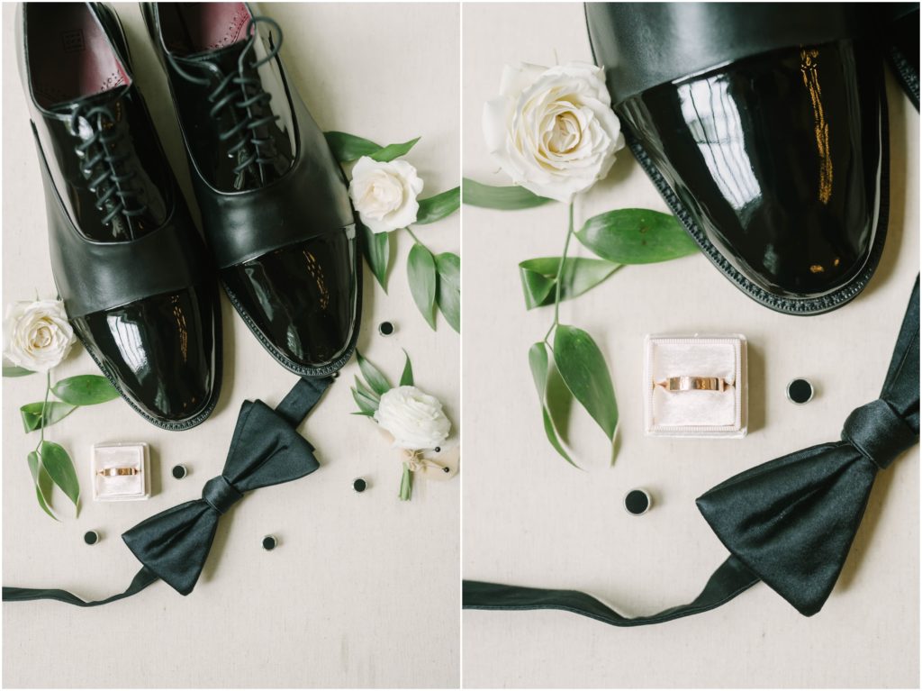 Christina Elliott Photography captures a flat lay of the groom's accessories includeing black shoes, bowtie and wedding ring near Houston, Texas. groom flat lay photos black groom accessories bowtie #christinaelliottphotography #christinaelliottweddings #houstontx #houstonweddings #houstonweddingphotographers #carriagehousewedding #conroetexas #texasweddingvenues #carriagehousechapel #cottageweddings #farmhousewedding #sweatheartweddinggown #countrywedding #weddinginspiration