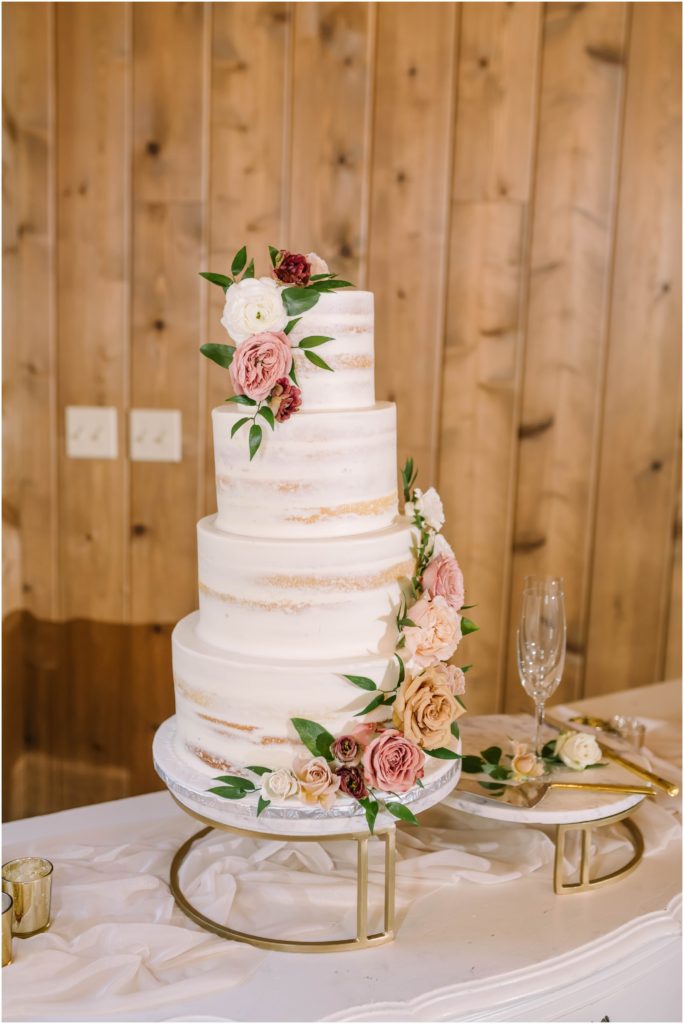 Beautiful wedding cake with white butter cream frosting and four tiers of wedding cake with fresh florals by Christina Elliott Photography from Houston, Texas. four-tier wedding cake smooth side cake half-naked cake #christinaelliottphotography #christinaelliottweddings #houstontx #houstonweddings #houstonweddingphotographers #carriagehousewedding #conroetexas #texasweddingvenues #carriagehousechapel #cottageweddings #farmhousewedding #sweatheartweddinggown #countrywedding #weddinginspiration
