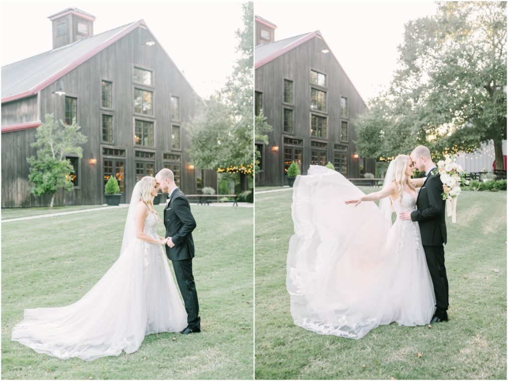 Outside a big black barn in Texas a couple hold each other close as the bride's gown flies behind her by Christina Elliott Photography. black barn wedding gown in the wind newly married #christinaelliottphotography #christinaelliottweddings #houstontx #houstonweddings #houstonweddingphotographers #carriagehousewedding #conroetexas #texasweddingvenues #carriagehousechapel #cottageweddings #farmhousewedding #sweatheartweddinggown #countrywedding #weddinginspiration