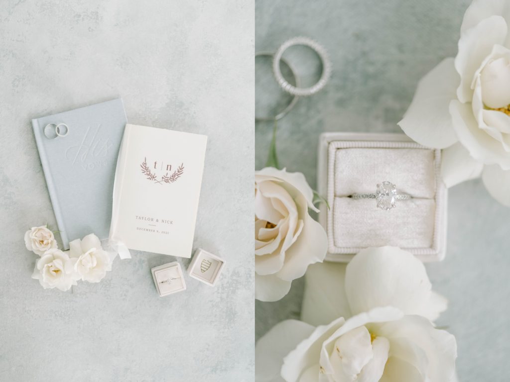 Oval diamond wedding ring with small diamond band surrounded by white rose florals by Christina Elliott Photography. oval wedding ring #christinaelliottphotography #theoakatelierwedding #Houstonwinterweddings #weddingphotographersHouston