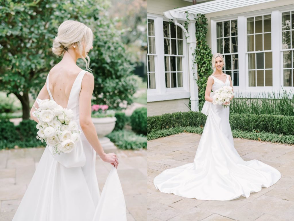 With a knotted bun updo a bride holds her bouquet behind her back captured by Christina Elliott Photography. modern bridal style garden bridal portrait #christinaelliottphotography #houstonweddings #riveroaksgardenclub #outdoorbridals #houstonbridals