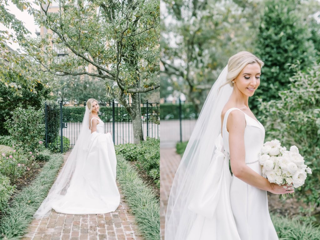 Houston professional photographer captures a bride with her veil billowing in the wind by Christina Elliott Photography. smiling bride billowing veil #christinaelliottphotography #houstonweddings #riveroaksgardenclub #outdoorbridals #houstonbridals