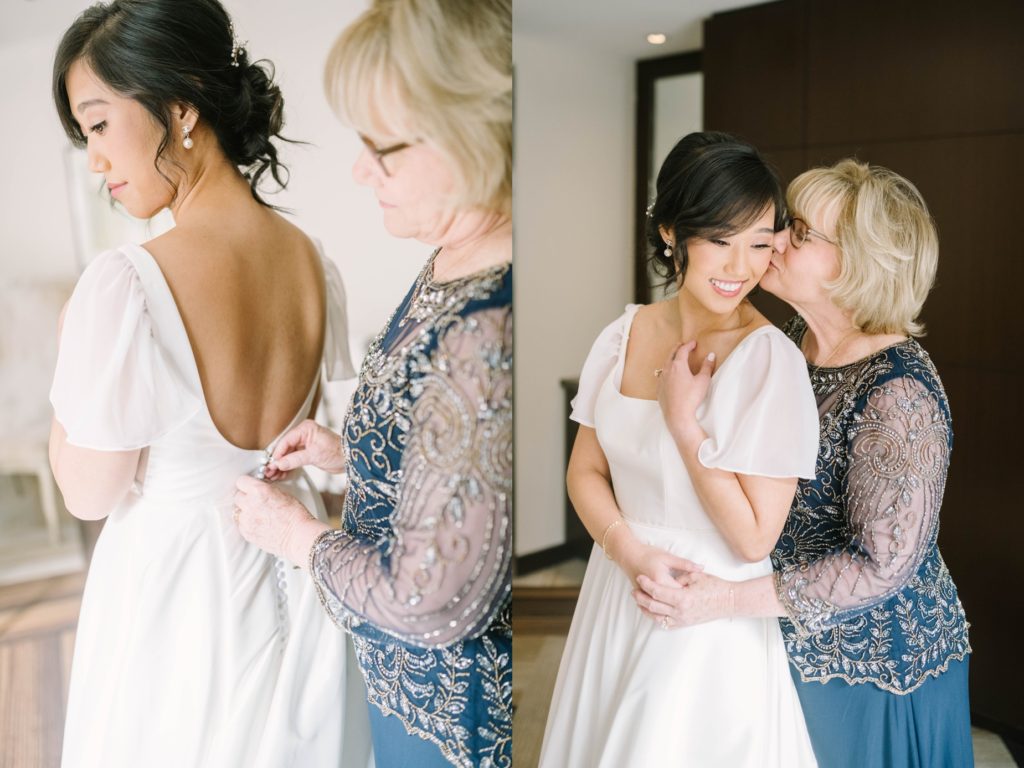 Mother of the bride kisses her daughter as she helps her get ready by Christina Elliott Photography. mother of the bride wedding bridal suite #christinaelliottphotography #thesamhoustonhotel #houstonweddings #TXweddingphotographer