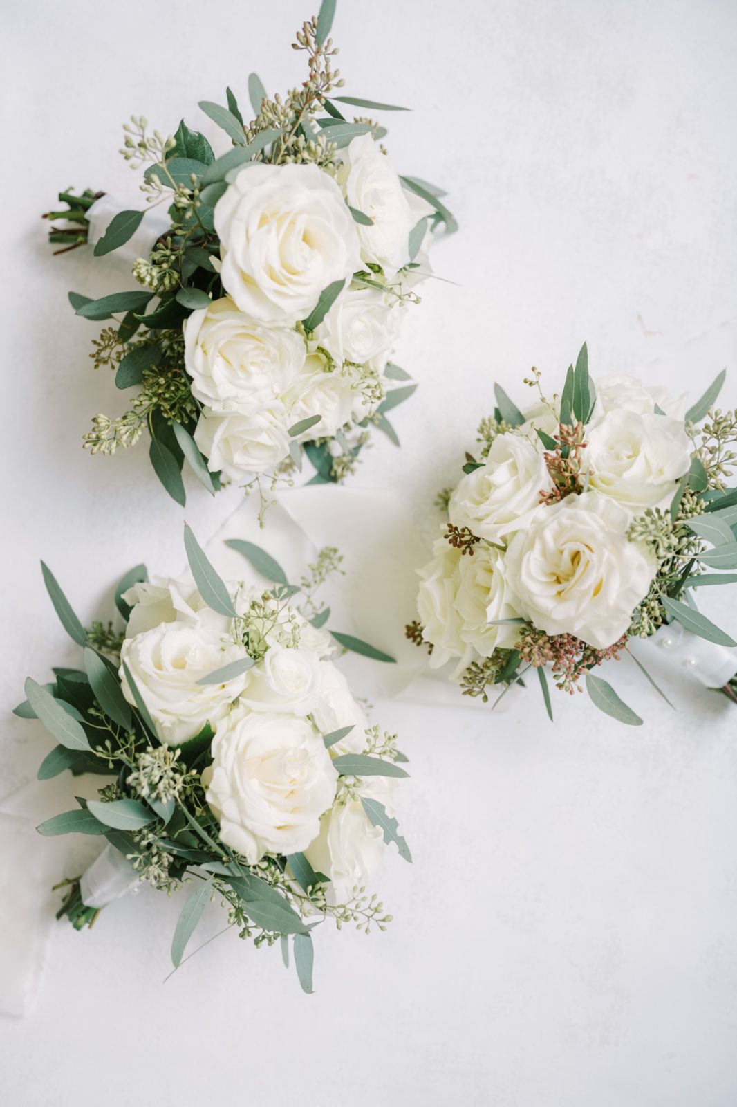 Christina Elliott Photography captures pictures of white rose bridal bouquets for Texas Wedding. white rose bouquets #ChristinaElliottPhotography #ChristinaElliottWeddings #StillWatersRanchWedding #Texasweddings #countrywedding #ranchwedding