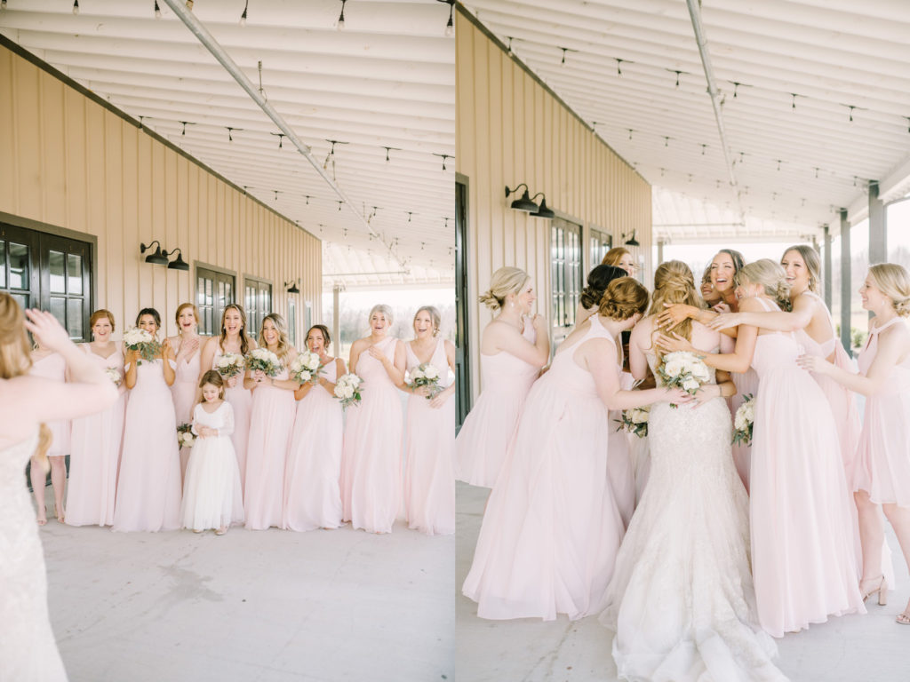 Bridesmaids embrace the bride as they share a first look captured by Christina Elliott Photography. first look hug bride #ChristinaElliottPhotography #ChristinaElliottWeddings #StillWatersRanchWedding #Texasweddings #countrywedding #ranchwedding