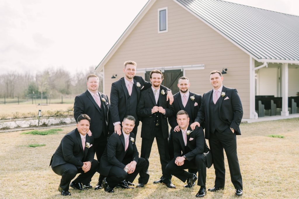 At Still Waters Ranch a group of groomsmen pose with groom by Christina Elliott Photography. groomsmen portrait ideas #ChristinaElliottPhotography #ChristinaElliottWeddings #StillWatersRanchWedding #Texasweddings #countrywedding #ranchwedding