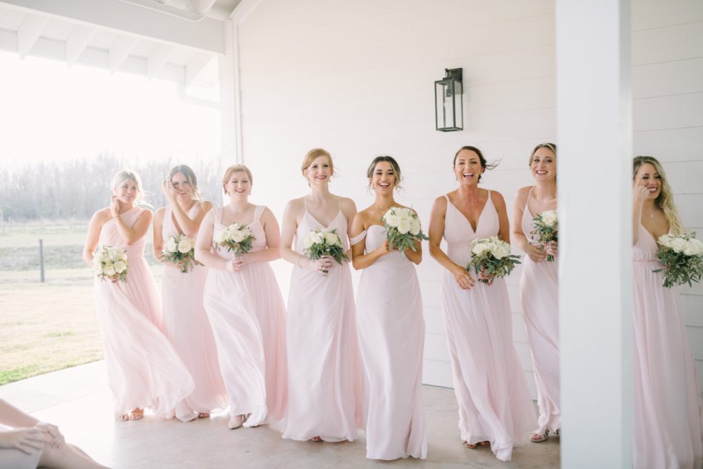 Baby pink bridesmaids dresses for a summer wedding vibe by Christina Elliott Photography. summer wedding color ideas pink #ChristinaElliottPhotography #ChristinaElliottWeddings #StillWatersRanchWedding #Texasweddings #countrywedding #ranchwedding