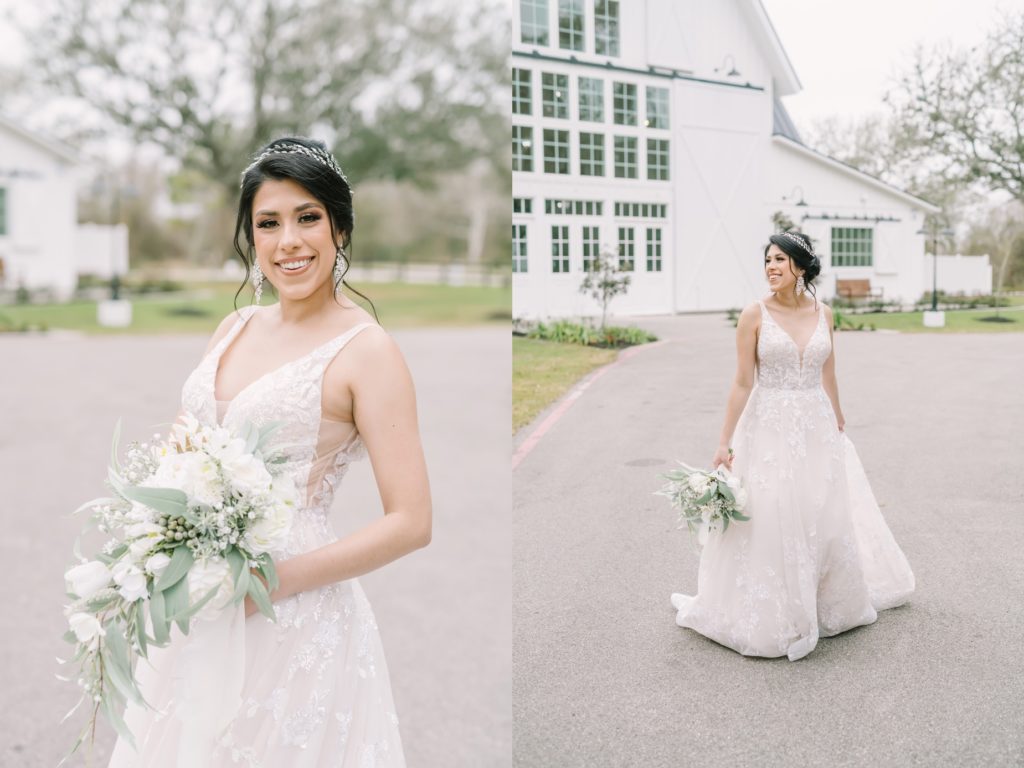 In front of a white farmhouse in Houston a bride holds her lace gown captured by Christina Elliott Photography. Houston weddings #ChristinaElliottPhotography #ChristinaElliottBridals #Houstonweddings #Farmhousewedding #TheSpringsVenue #BridalsHouston