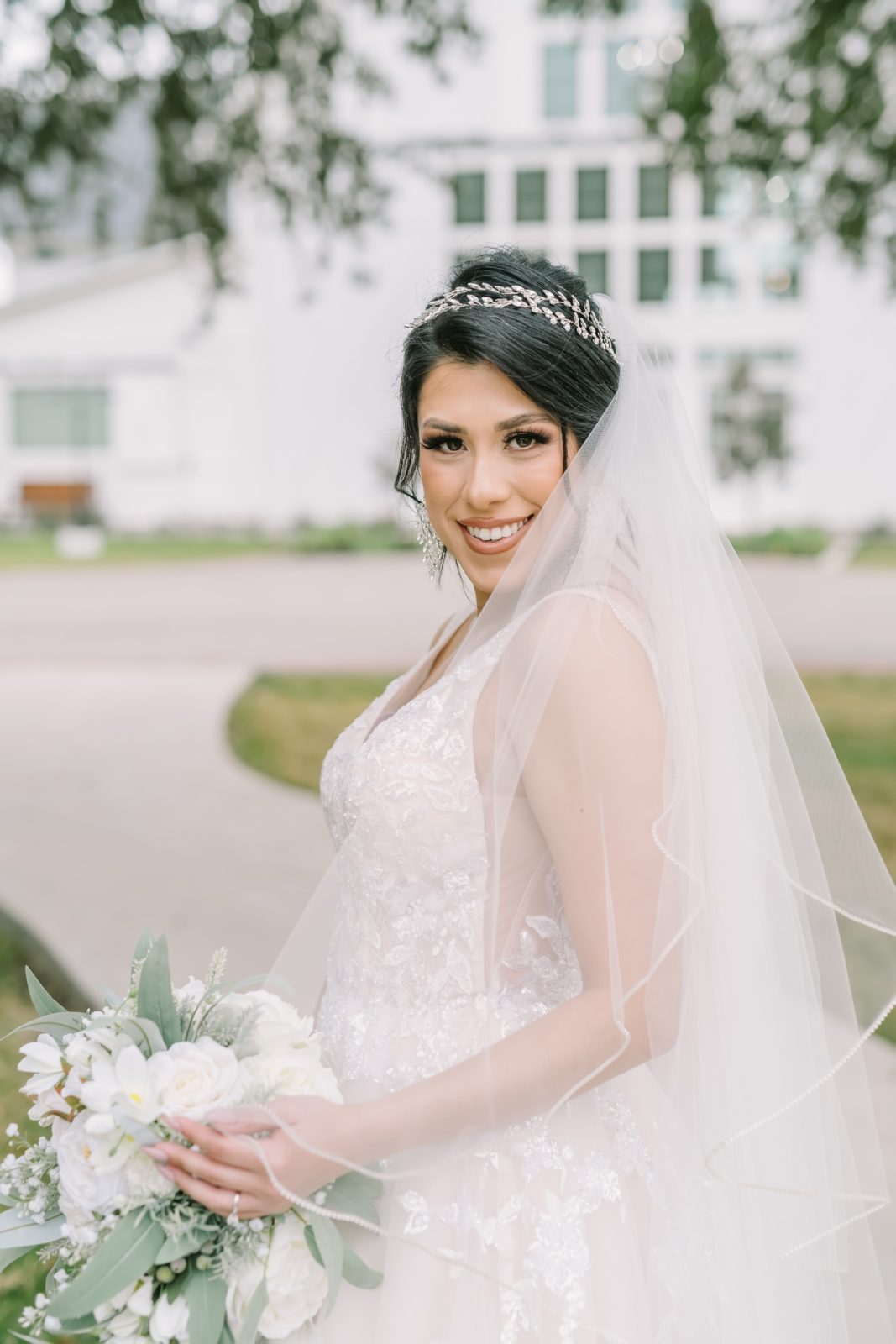Summer bridal portrait in front of a farmhouse in East Houston by Christina Elliott Photography. white bouquet sheer veil #ChristinaElliottPhotography #ChristinaElliottBridals #Houstonweddings #Farmhousewedding #TheSpringsVenue #BridalsHouston