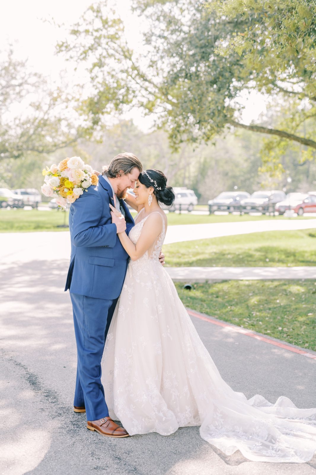 With her wedding train flowing back a bride places her hand on the groom's chest by Christina Elliott Photography. hand on chest #ChristinaElliottPhotography #ChristinaElliottWeddings #Houstonwedding #TheSpringsVenue #EastHoustonweddings #Mrs #Mr