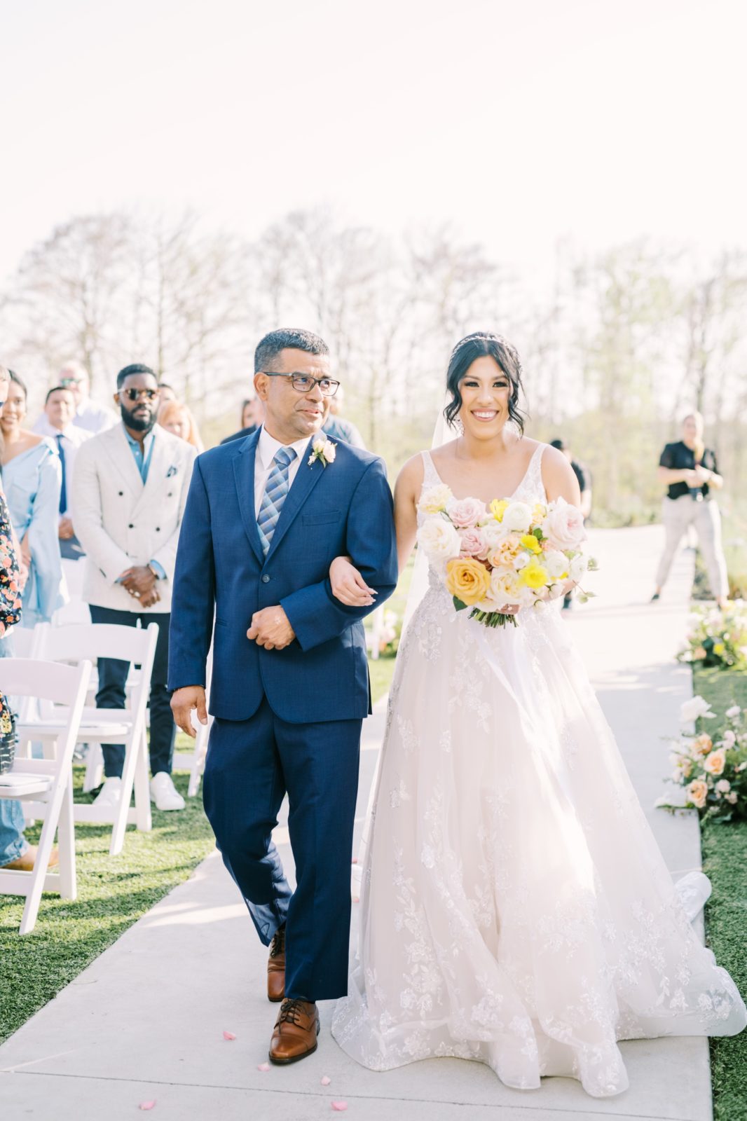 Houston wedding photographer, Christina Elliott Photography captures a bride walking down the aisle with her father. here comes the bride #ChristinaElliottPhotography #ChristinaElliottWeddings #Houstonwedding #TheSpringsVenue #EastHoustonweddings