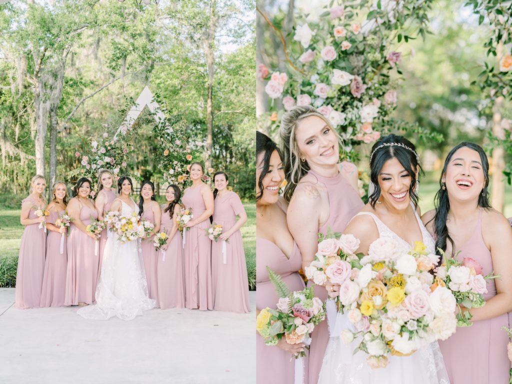 A bridal party in pink standing in front of rose wedding altar by Christina Elliott Photography. Houston barn wedding venue #ChristinaElliottPhotography #ChristinaElliottWeddings #Houstonwedding #TheSpringsVenue #EastHoustonweddings #sayIdo