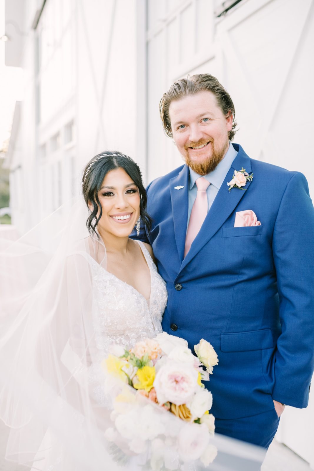 Close-up portrait of the newlyweds with a veil flowing in front by Christina Elliott Photography. veil portrait she said yes just married #ChristinaElliottPhotography #ChristinaElliottWeddings #Houstonwedding #TheSpringsVenue #EastHoustonweddings