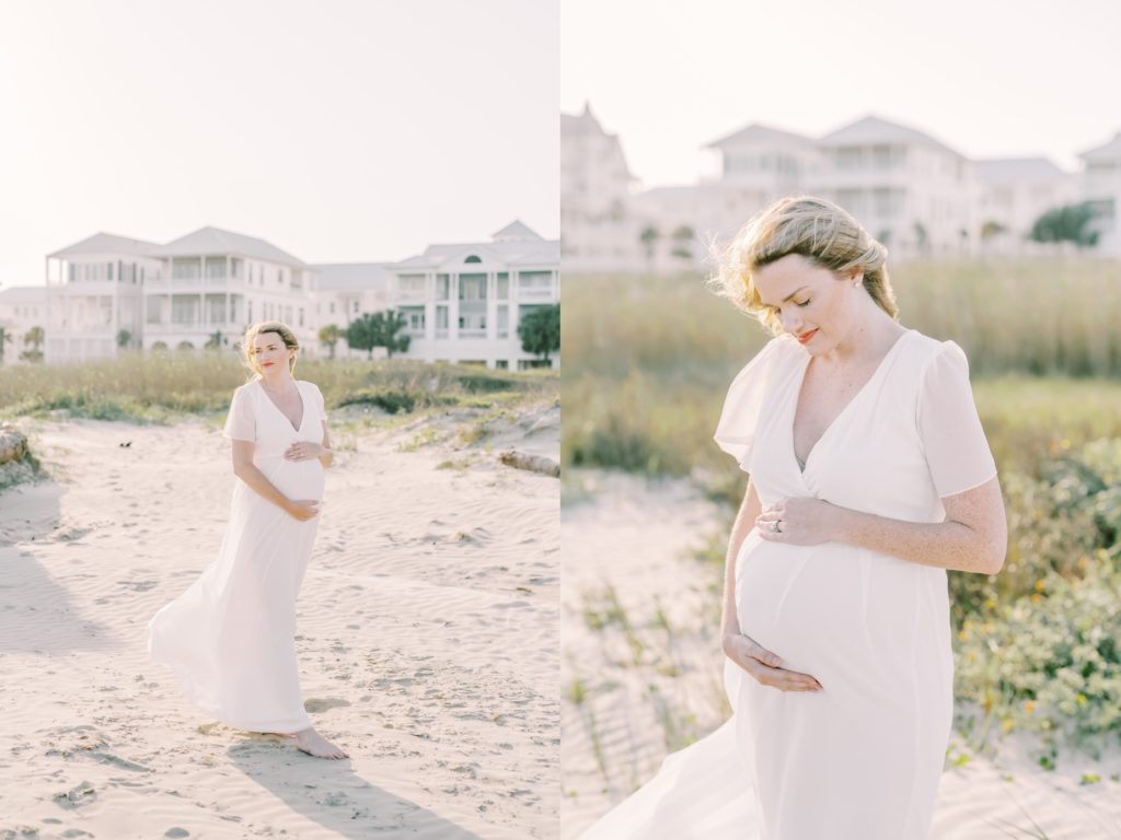Woman in a white flowy dress wraps her hands around her baby bump by Christina Elliott Photography. bump pic #ChristinaElliottPhotography #ChristinaElliottFamilies #GalvestonPhotography #Beachmaternityphotography #Texasfamilyphotographers