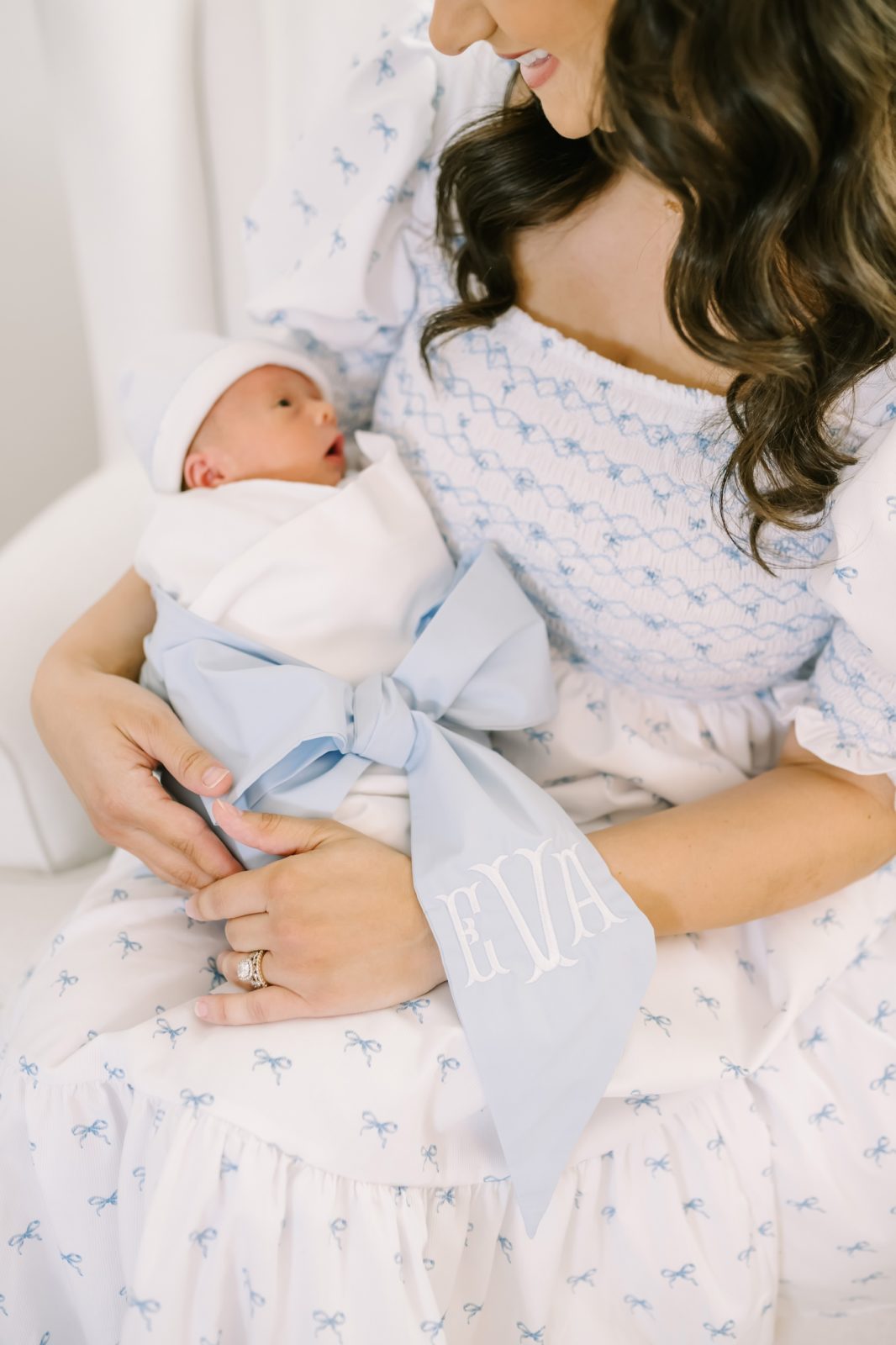 Detailed portrait of a mother holding her newborn baby by Christina Elliott Photography. close-up baby portrait smocked woman dress #ChristinaElliottPhotography #ChristinaElliottNewborns #HoustonLifestyleNewborns #HoustonFamilyPhotographer