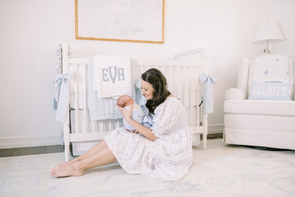 New baby being held by her mother by Christina Elliott Photography in Houston during an at-home session. in home newborn photography #ChristinaElliottPhotography #ChristinaElliottNewborns #HoustonLifestyleNewborns #HoustonFamilyPhotographer