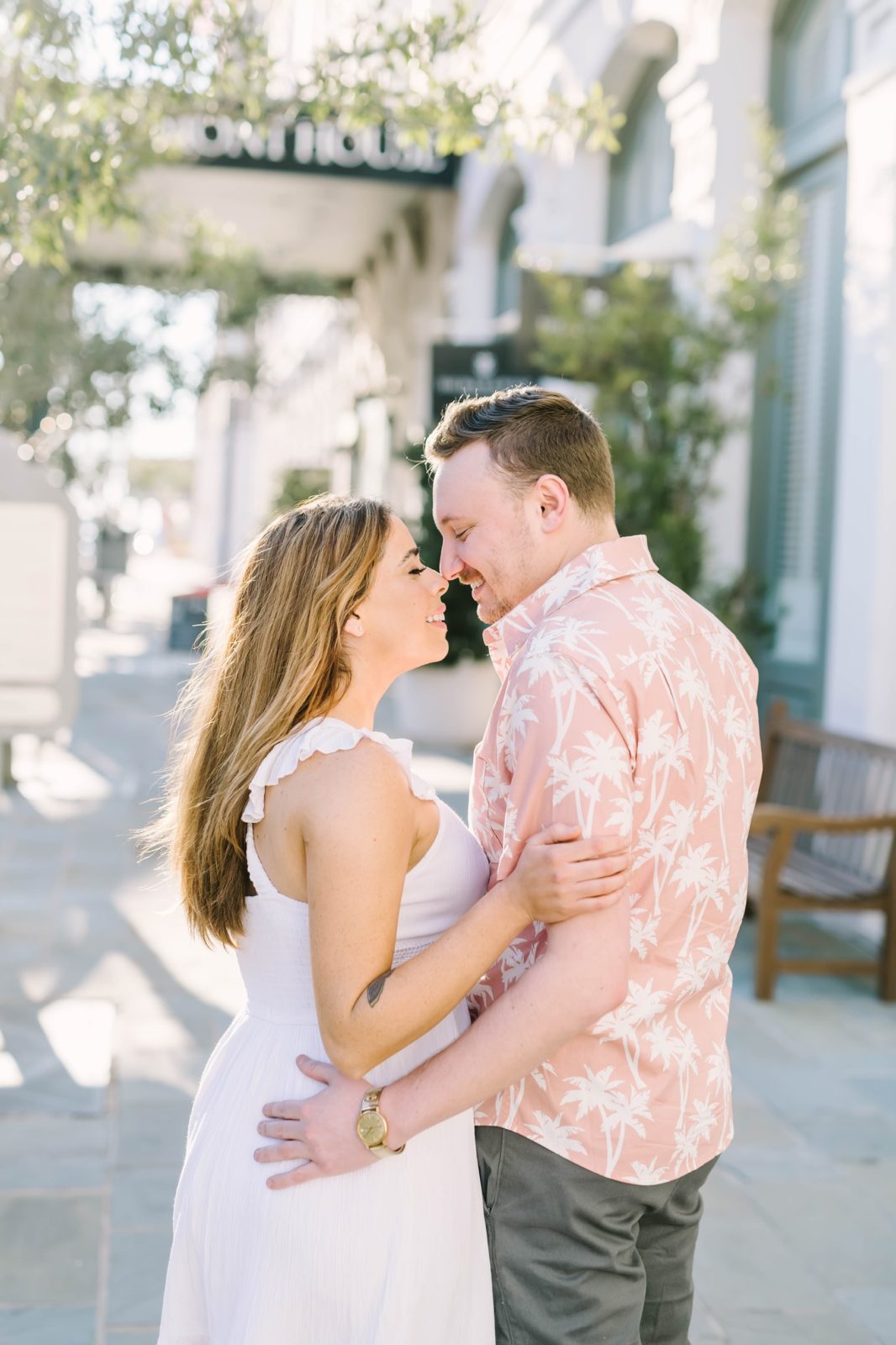 Portraits outside The Tremont House in Texas captured by Christina Elliott Photography. engaged couple kiss on the street #ChristinaElliottPhotography #ChristinaElliottEngagements #TheTremontHouse #Texasengagements #shesaidyes