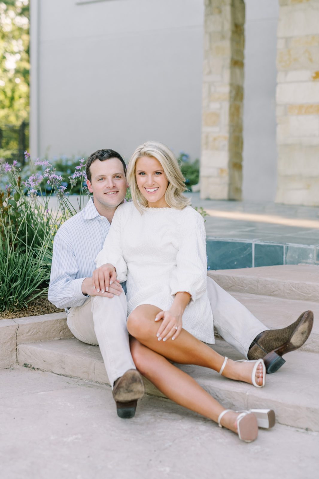 Christina Elliott Photography captures a photo of woman sitting next to her man on a stair. sitting engagement pose Houston photographer #ChristinaElliottPhotography #ChristinaElliottEngagements #LakeLivingston #summerengagements #Texasphotographer