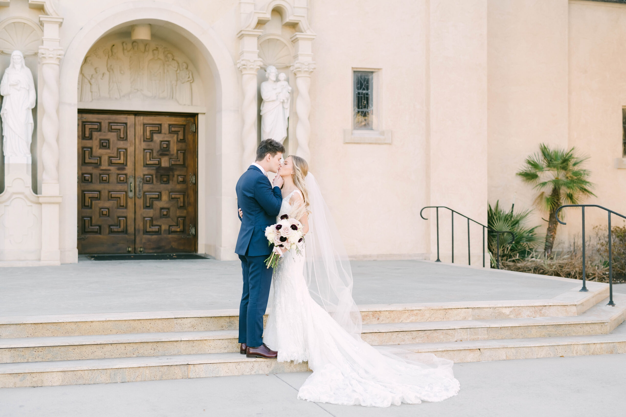 Bride and groom portraits outside of St Anne Catholic Church in Houston