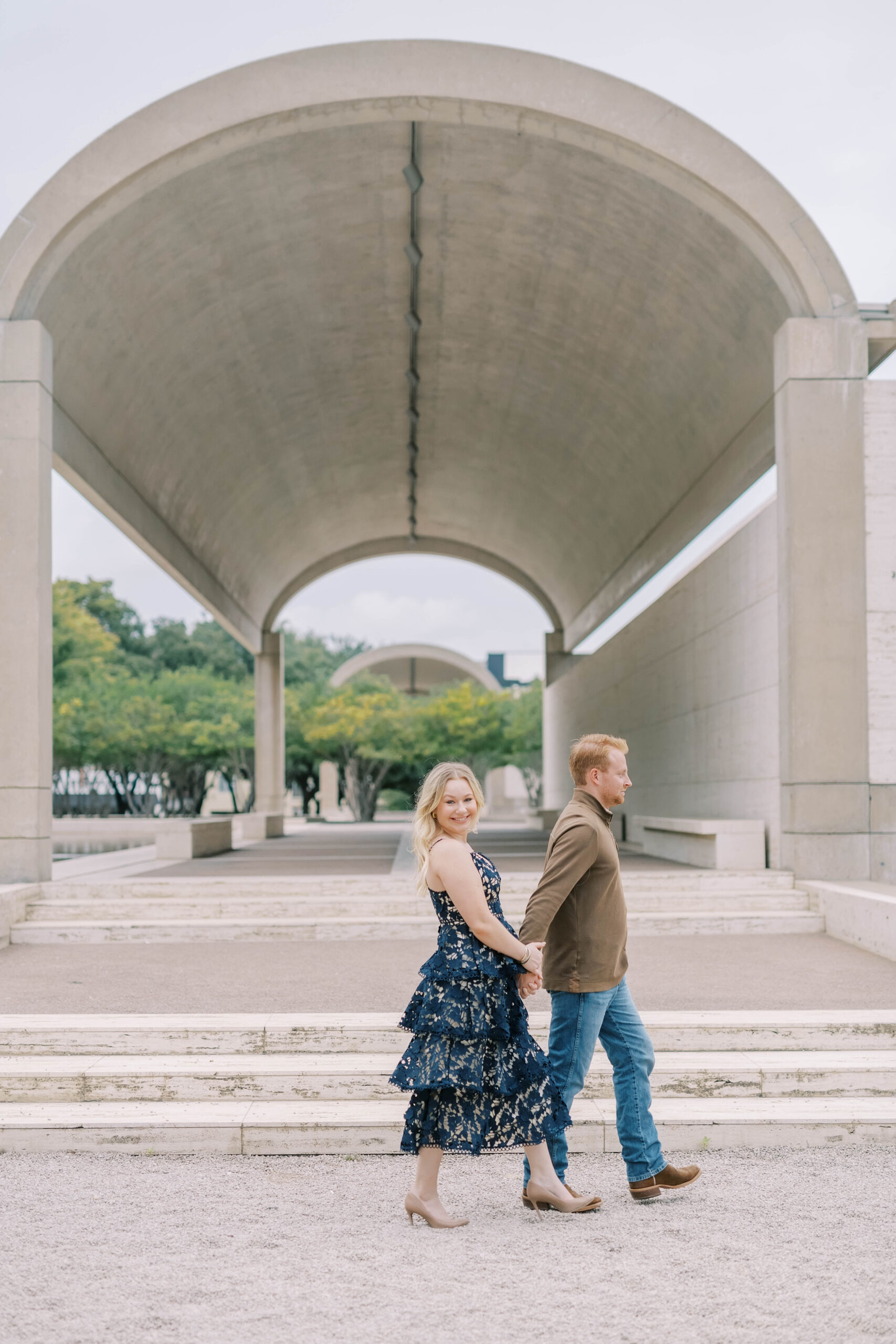 Couple posing for their Fort Worth engagement photos at Fort Worth Country Club