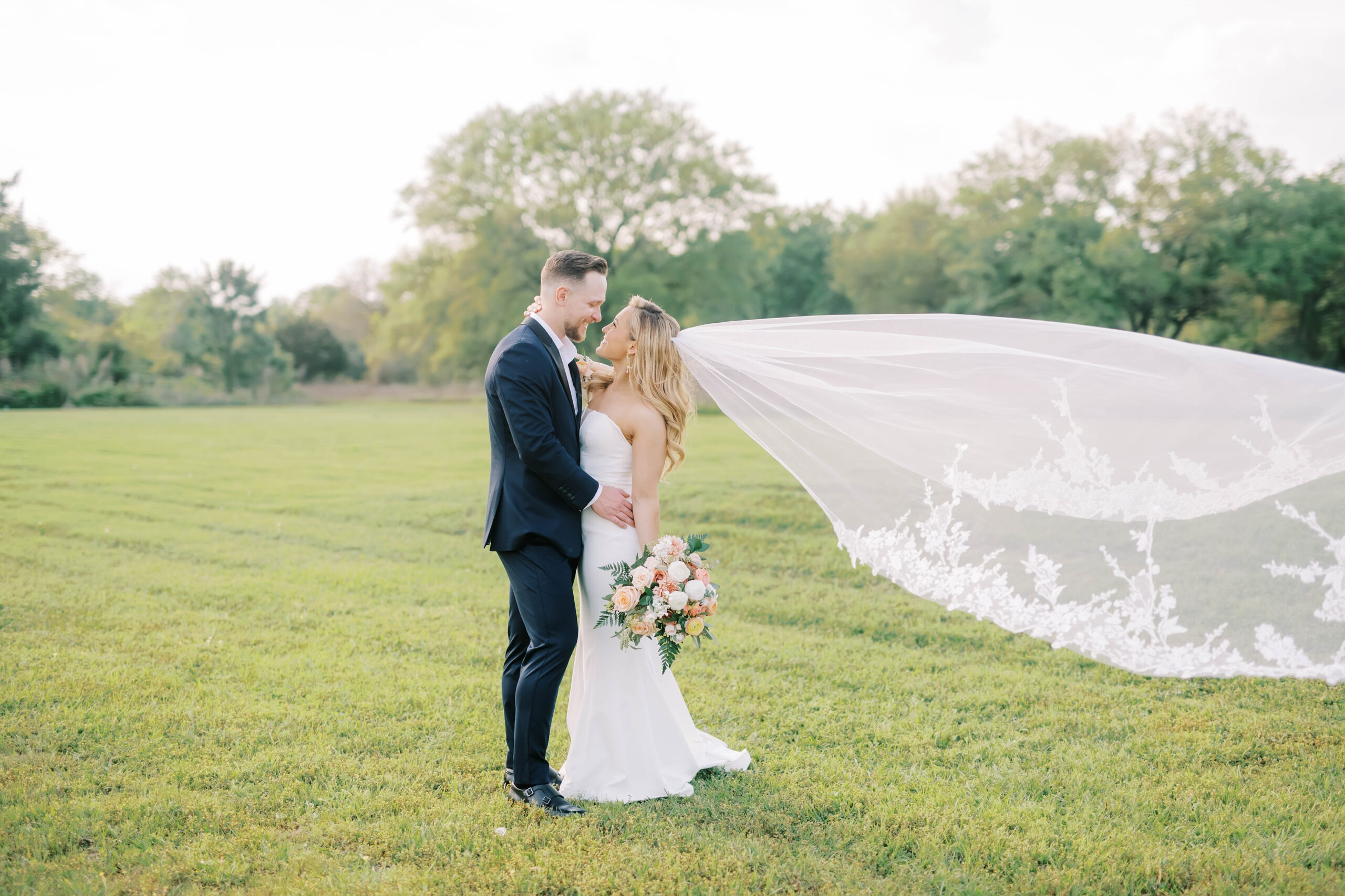 couple taking wedding photos at the bridal oak