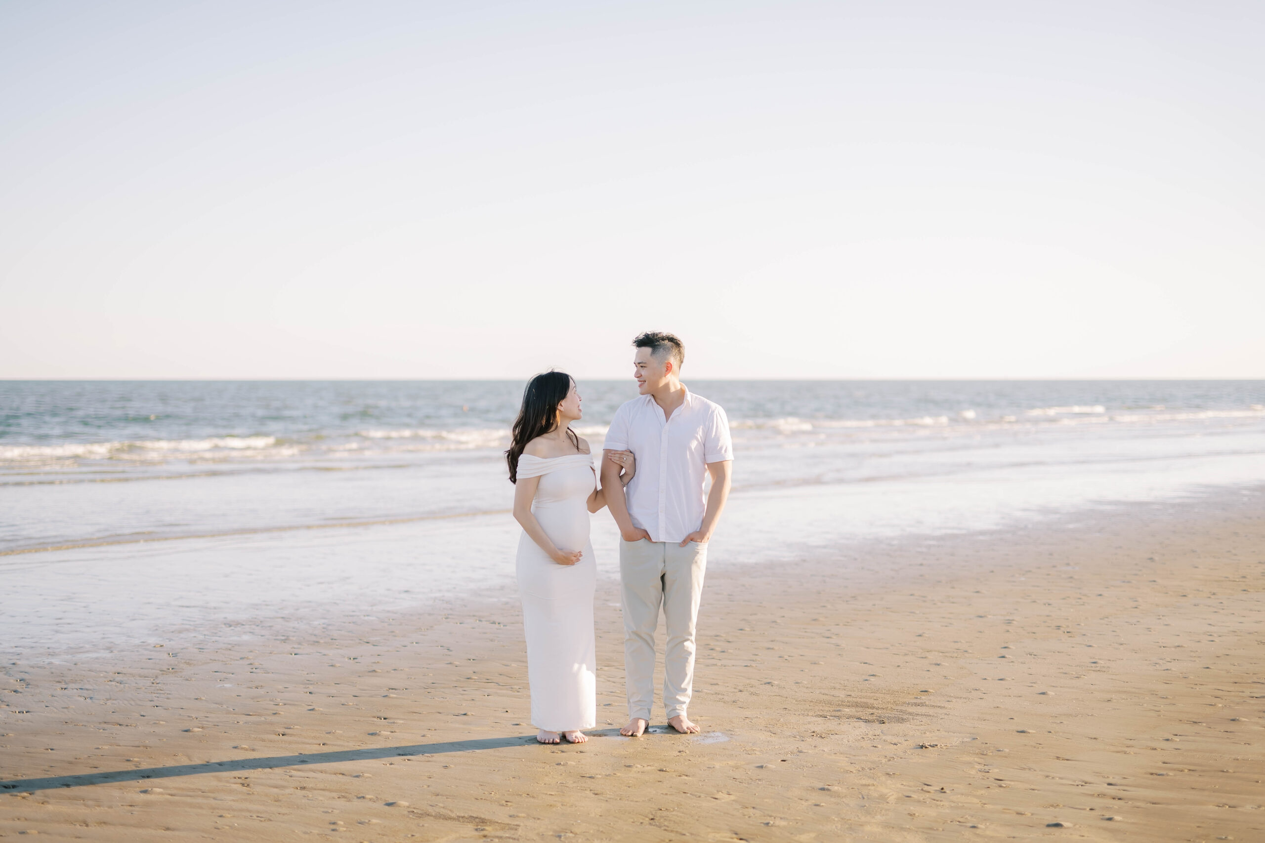 playful maternity photoshoot at the beach